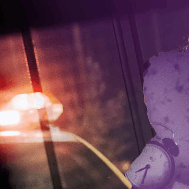 A collaged image where the windshield and roof of a police car are visible at the bottom left of the image; the red lights are flashing on the car. The right of the image has a purple flower-patterned wallpaper with an alarm clock and some books resting in front of it overlaid on the image background, which is a window with the blinds drawn.