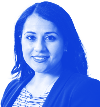 A blue-toned portrait photo of Rosi Lara. Lara is wearing a striped blouse and a dark cardigan; a thin necklace chain drapes under the shirt. She has shoulder-length dark hair that is parted to the side and is wearing small hoop earrings.