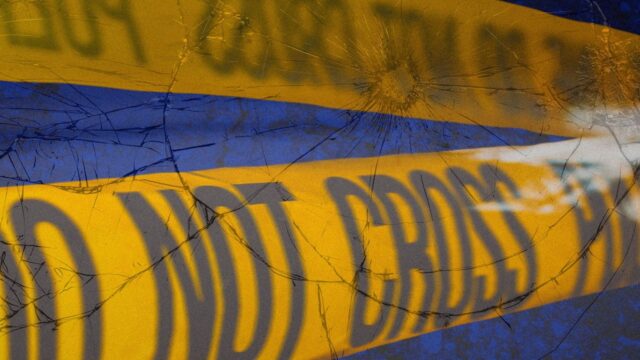 Yellow crime scene caution tape that reads